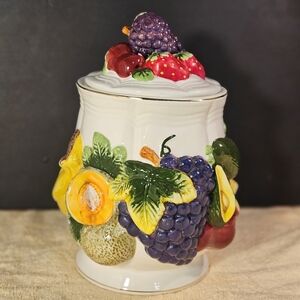 KMC extra large ceramic food storage canister with a colorful fruit motif.